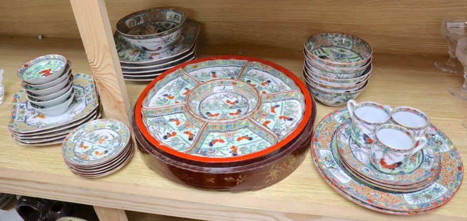 A collection of early 20th century Cantonese porcelain tea and dinnerwares, including an hors doeuvres set, in a lacquer box